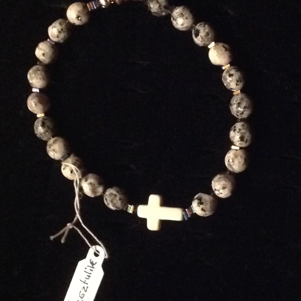 Azeztulile with cross bracelet